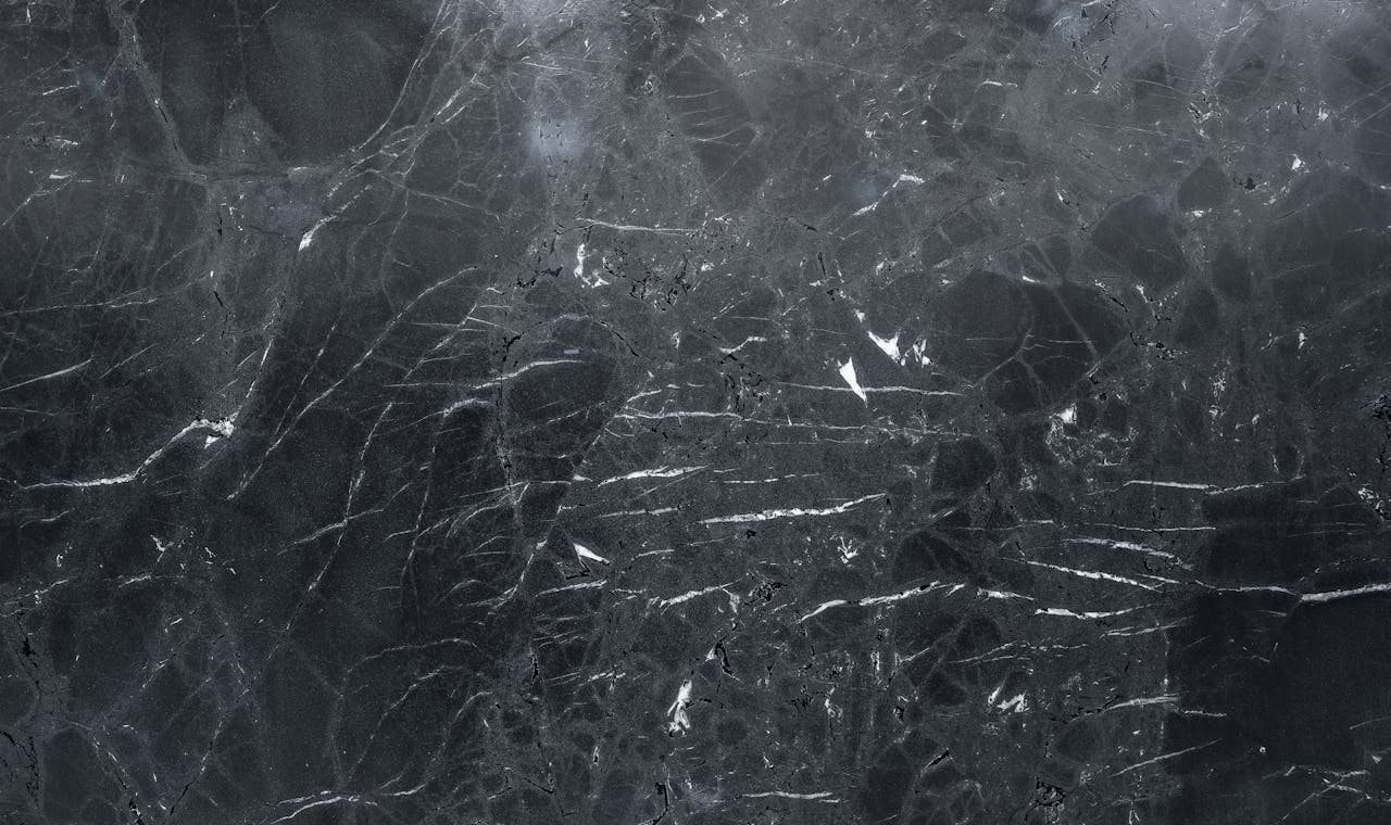 High-resolution dark marble texture, perfect for elegant backgrounds and design projects.