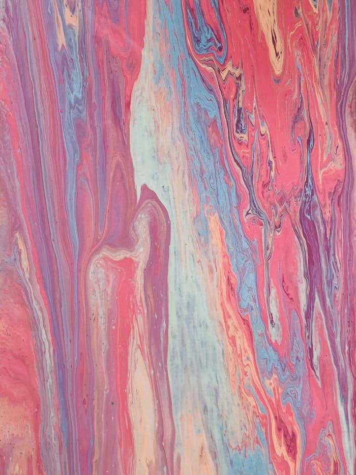 Colorful abstract pattern featuring swirling marbled paint textures.